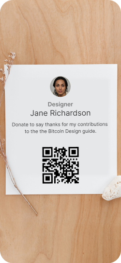 A sheet of paper with donation information for a bitcoin designer